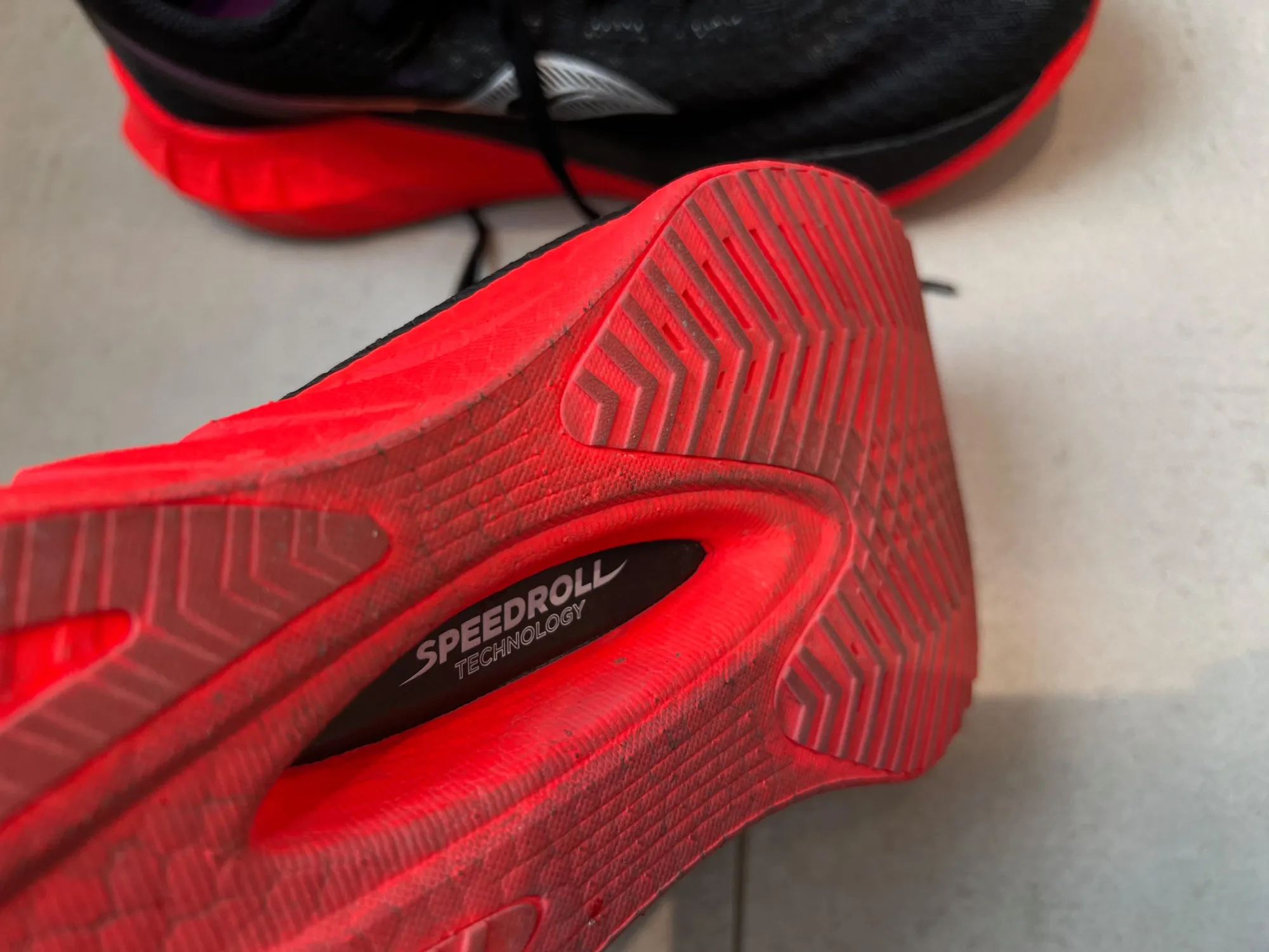 A photo of the red colored soles of the Saucony Endorphin Pro 4.