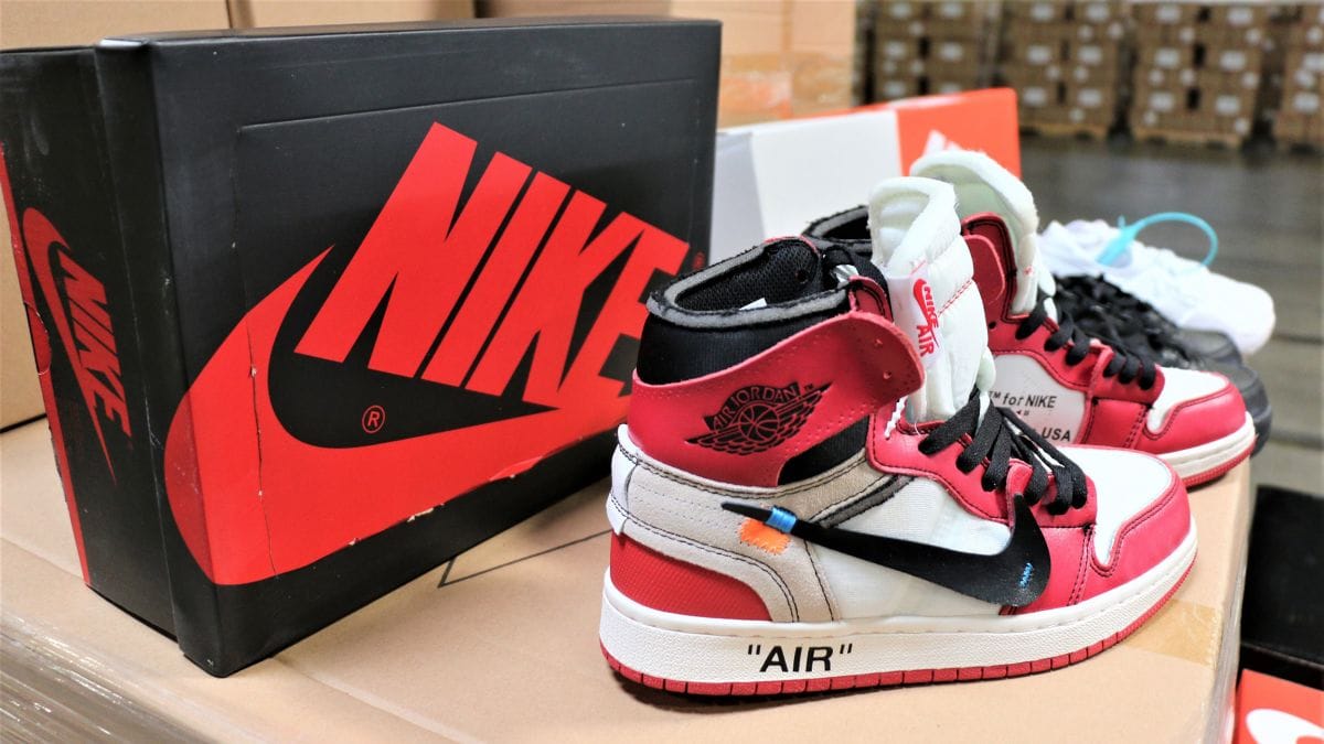A photo of a pair of AIR Jordan shoes in front of a Nike box